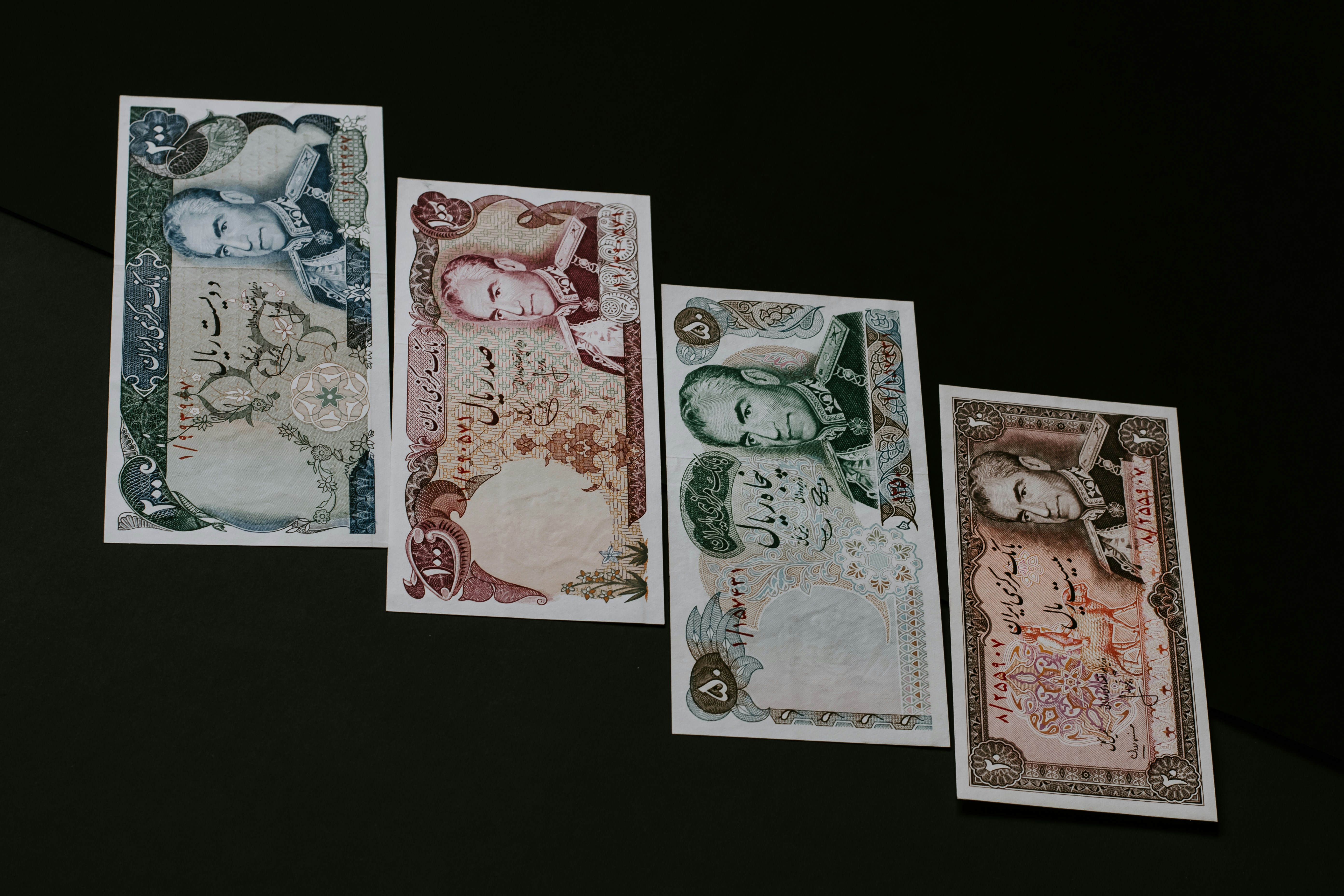 Former bills of Iran's Rial with the picture of middle-aged Mohammad Reza Shah on it.